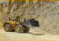 Wheel loader hauling rock